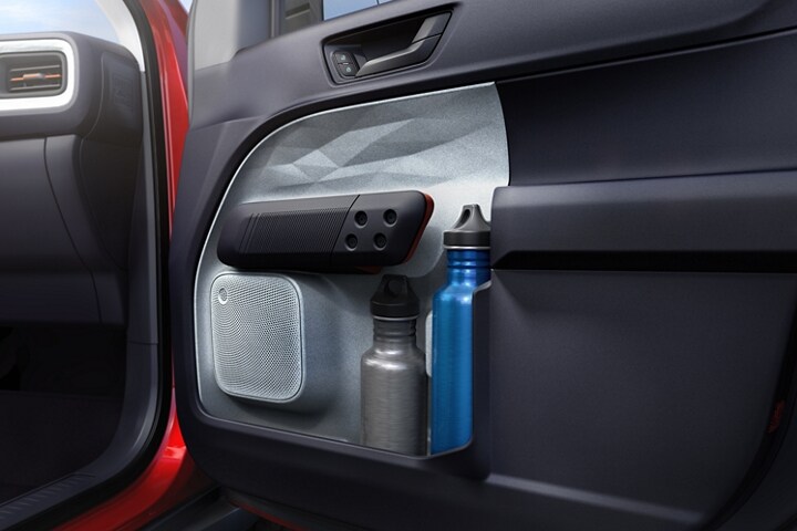 1.5L bottle and second smaller bottle in the door pocket storage of the 2023 Ford Maverick® truck