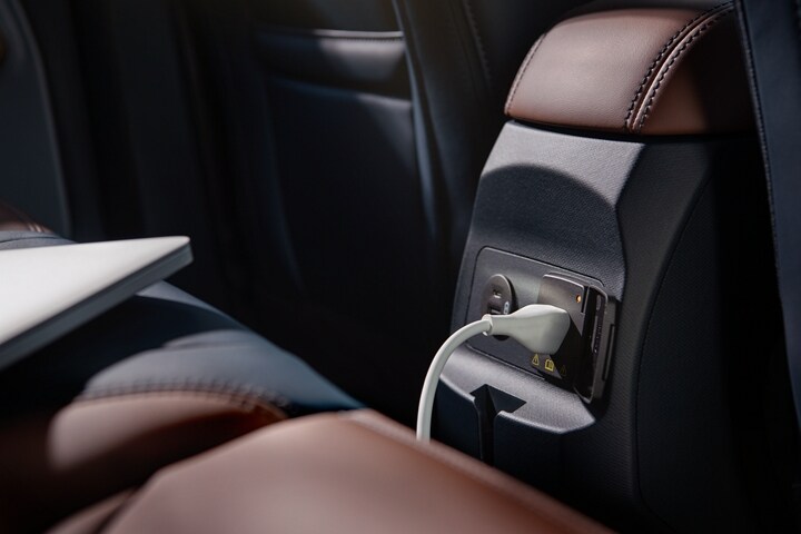 Laptop plugged into the 110V outlet in the cab of the 2023 Ford Maverick® truck