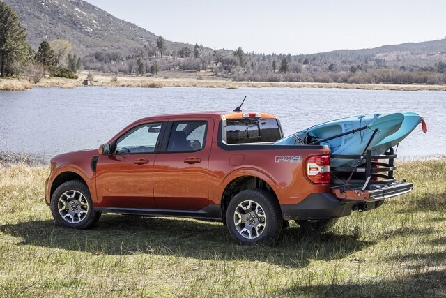2023 Ford Maverick® truck with bed extender next to a lake