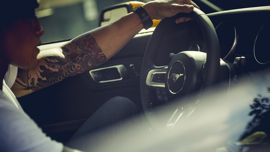 2023 Ford Mustang® coupe interior with a person driving
