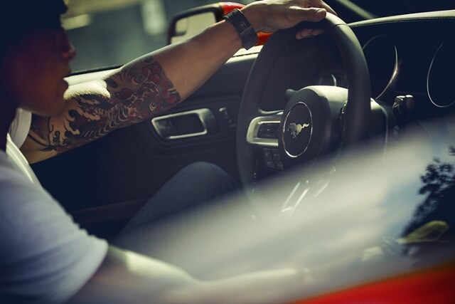 2023 Ford Mustang® coupe interior with a person driving