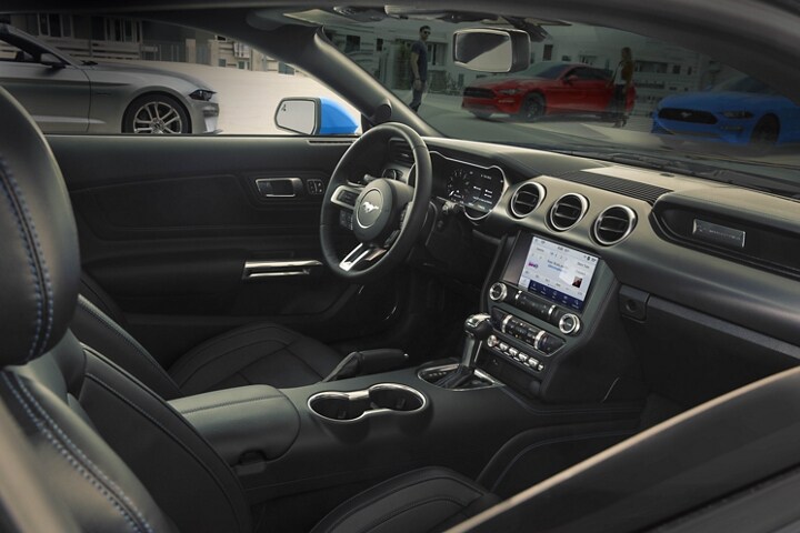 A 2023 Ford Mustang® coupe interior through the passenger-side window