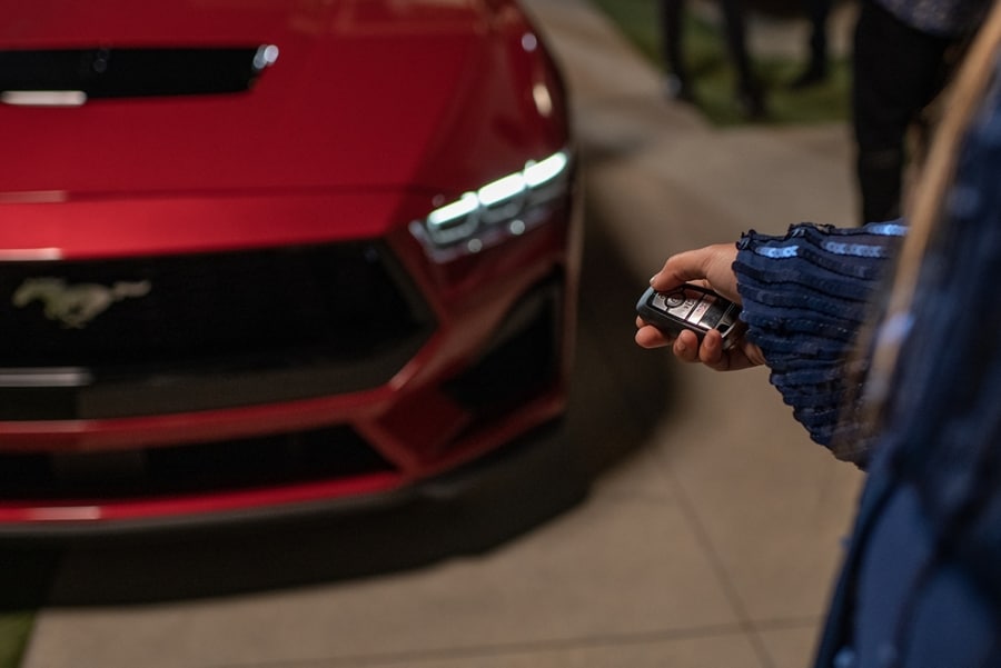 Person using the available remote start feature on a 2024 Ford Mustang® vehicle with available automatic transmission
