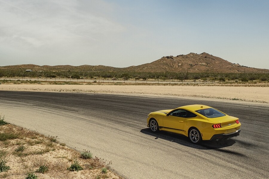 2024 Ford Mustang® EcoBoost® coupe being driven on a desert road