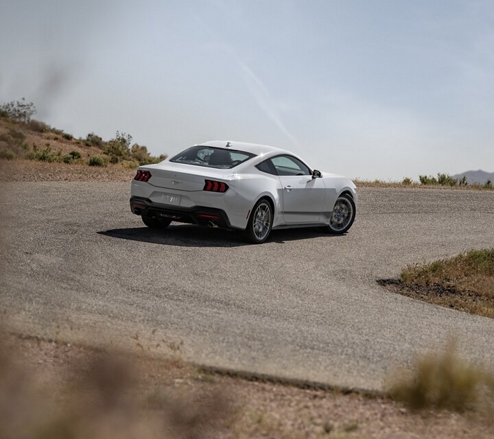 2024 Ford Mustang® EcoBoost® coupe being driven on a desert road