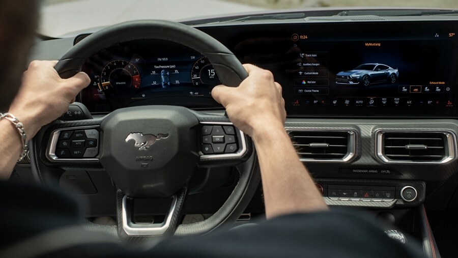 Interior view of a person driving a 2024 Ford Mustang® coupe