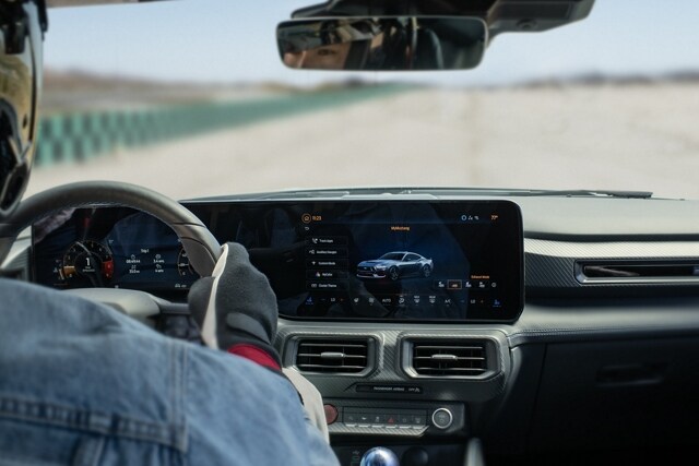 Person driving a 2024 Ford Mustang® coupe on a closed course