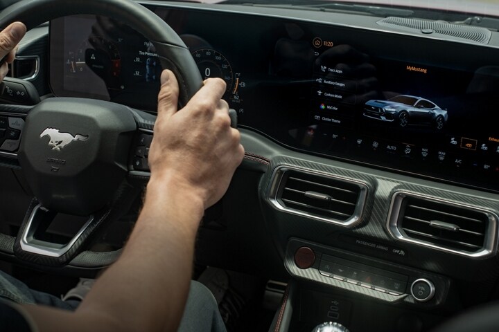 Person driving a 2024 Mustang® coupe