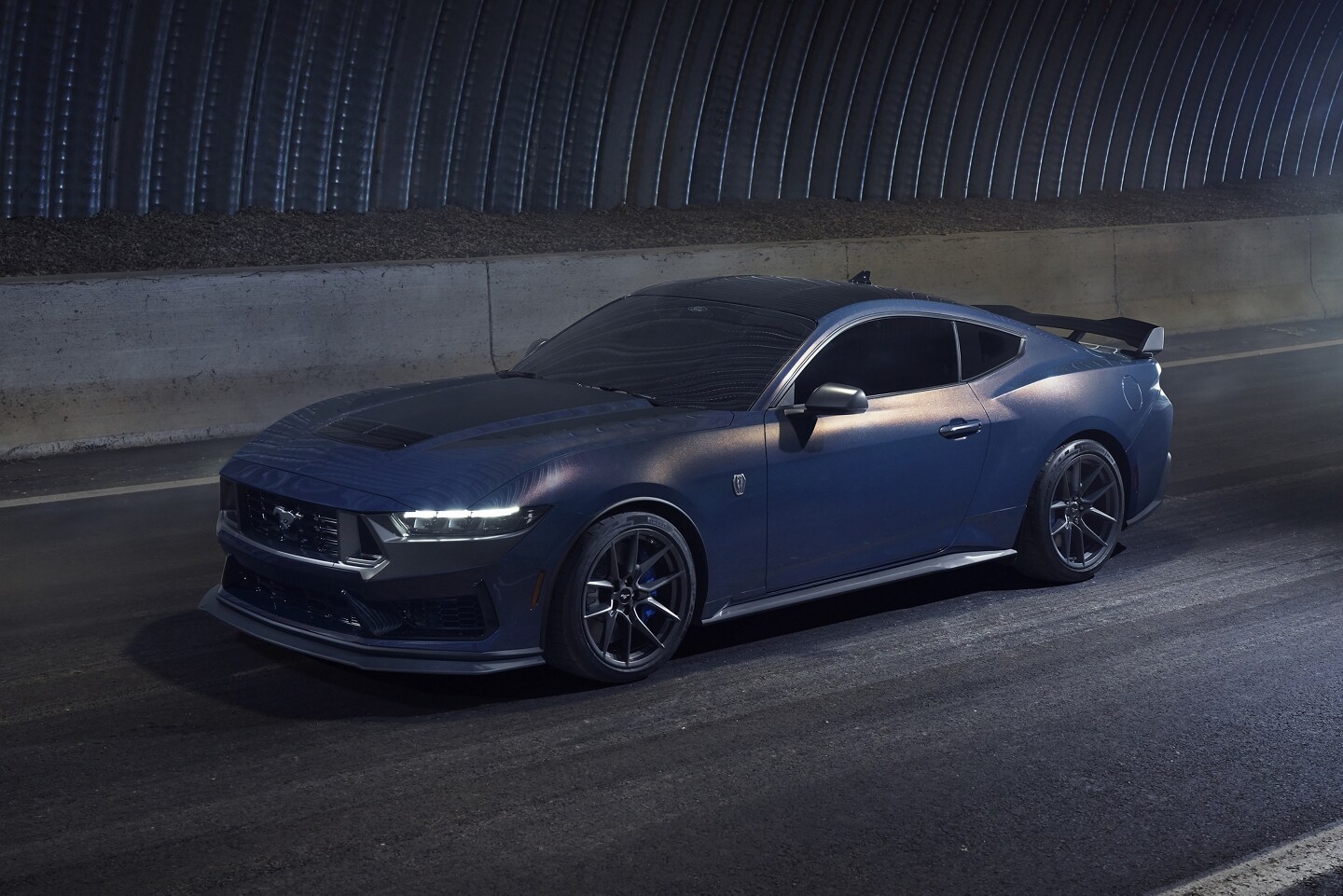 2024 Ford Mustang® Dark Horse™ coupe being driven in a tunnel