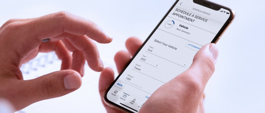 Person using the FordPass® App on a smartphone