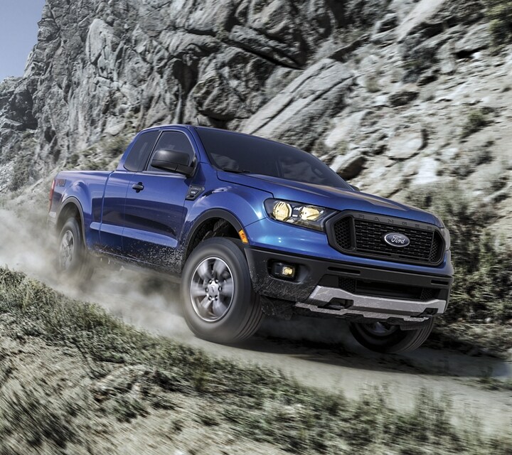 2022 Ford Ranger in Velocity Blue on a mountain road.