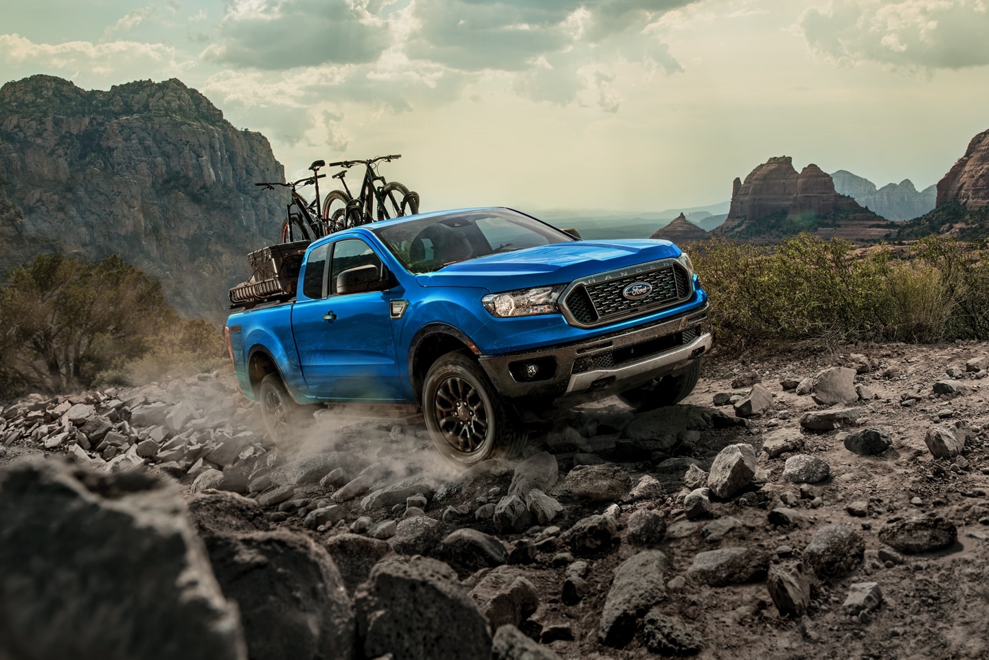 2023 Ford Ranger XLT Sport with FX4 Off-Road Package, driving over a rocky road