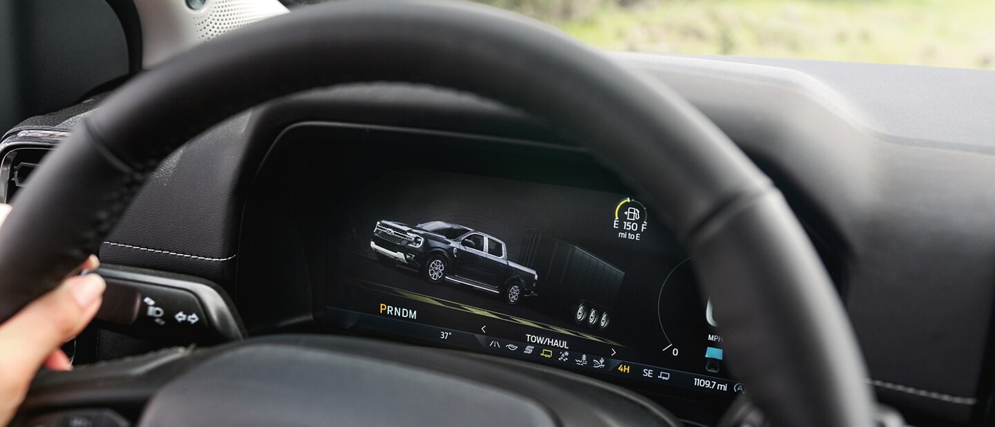 Close-up of a 2024 Ford Ranger® steering wheel with Tow/Haul mode engaged