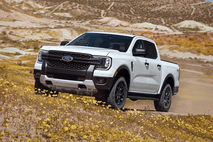 A 2024 Ford Ranger® XLT in Oxford White with Sport and FX4® Off-Road Package in a scenic location