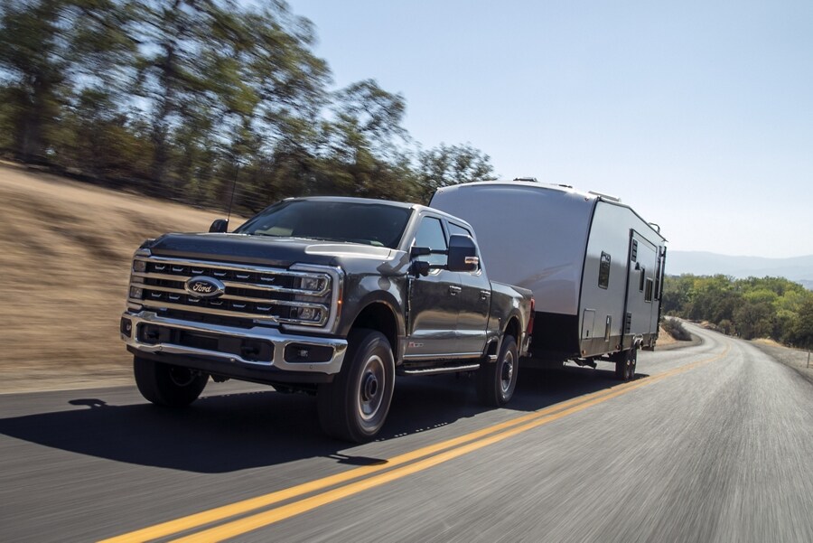 2023 Ford Super Duty® F-250® Tremor® truck pulling a camper trailer