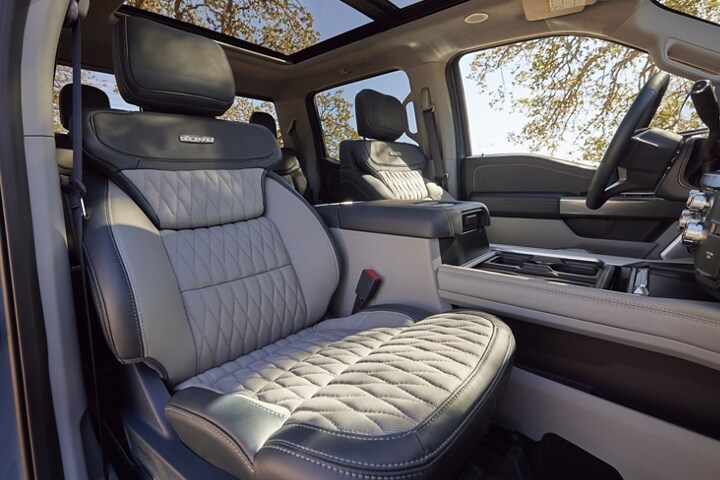 Interior of a 2023 Ford Super Duty® F-350® Limited model with Admiral Blue Light Slate two-tone leather seats