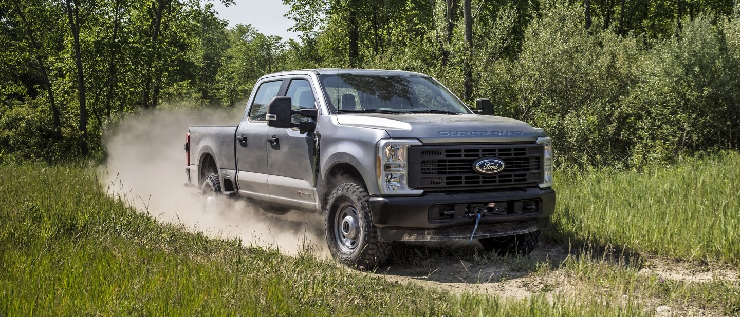A Ford Super Duty® XL F-350® Tremor® on a dirt path