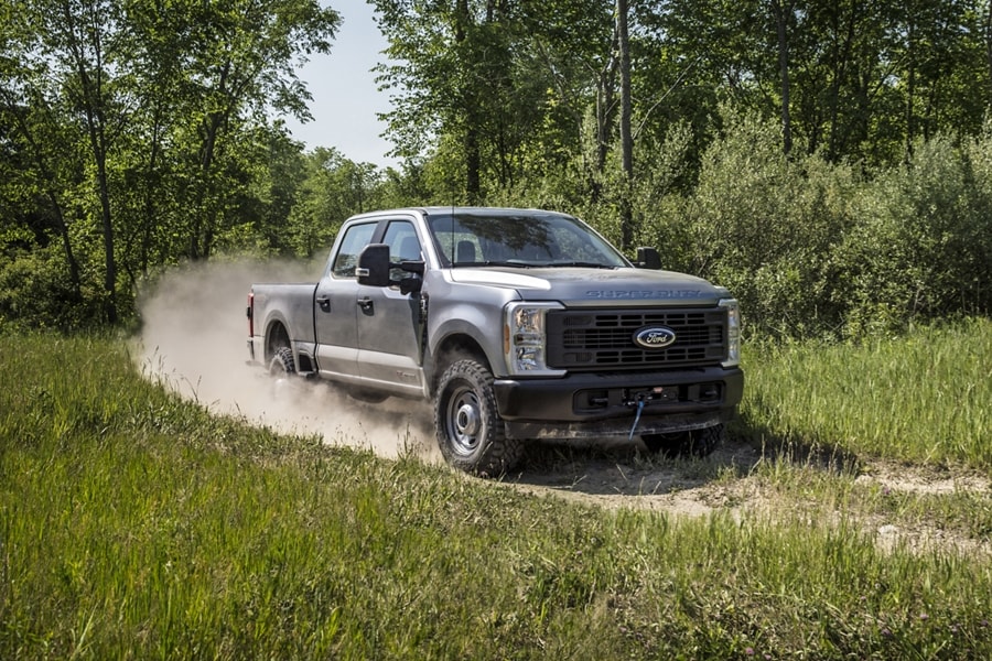 A 2024 Ford Super Duty® XL F-350® Tremor® on a dirt path