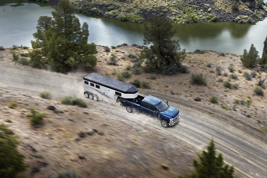 2024 Ford Super Duty® F-350® LARIAT® model pulling a horse trailer