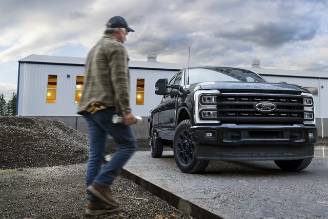 Man walking near a 2024 Ford Super Duty® pickup