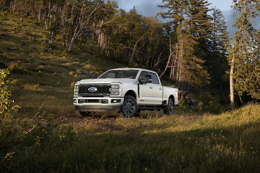 2024 Ford Super Duty® F-350® LARIAT® model parked in a wooded area