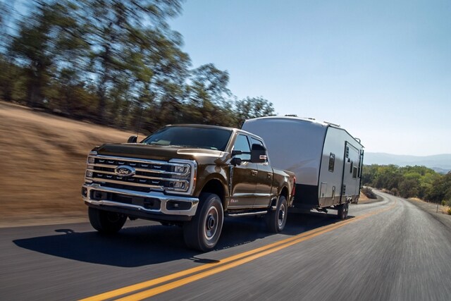 2024 Ford Super Duty® F-250® Tremor® truck pulling a camper trailer