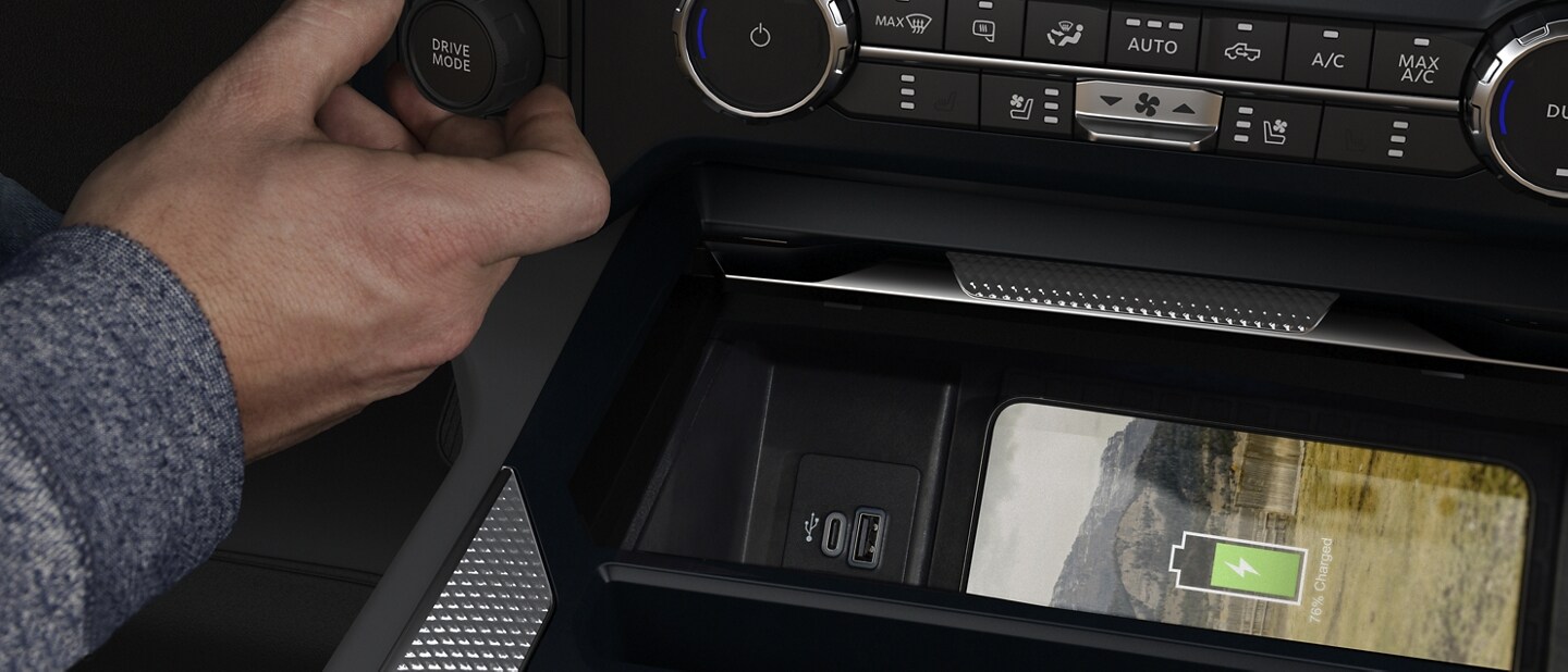 Close-up showing phone charging on wireless charging pad in a 2023 Ford Super Duty® truck