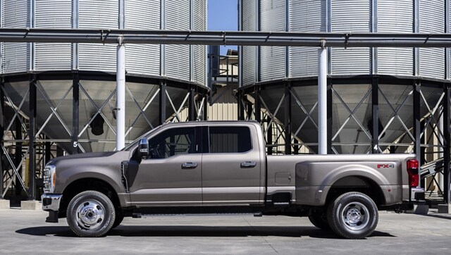 2024 Ford Super Duty® F-350® LARIAT parked near a grain silo
