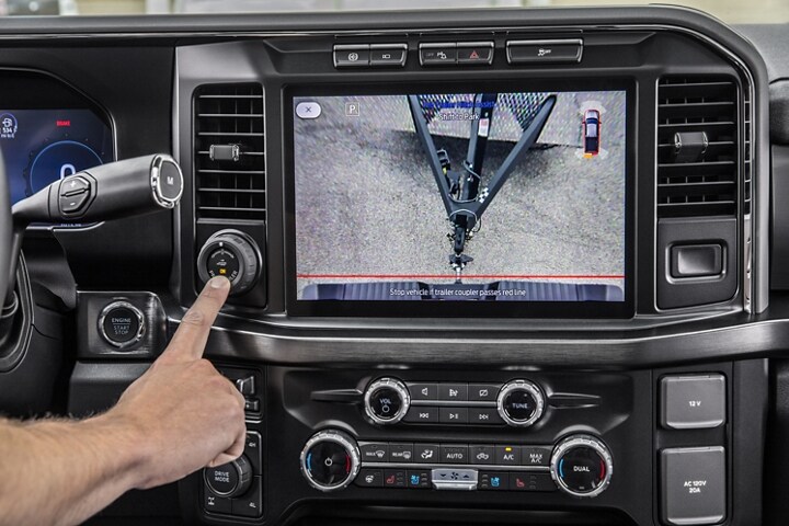 Driver using Pro Trailer Hitch Assist on a 2024 Super Duty® truck