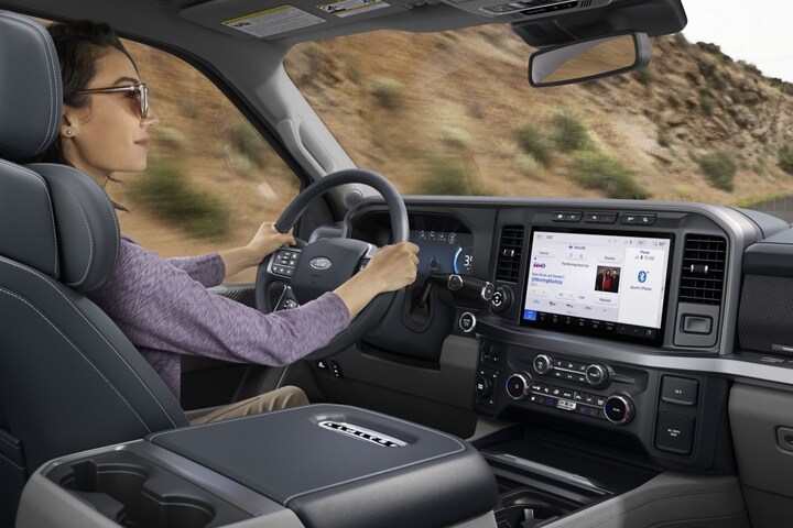 A woman driving a 2024 Ford Super Duty® F-450® Limited truck
