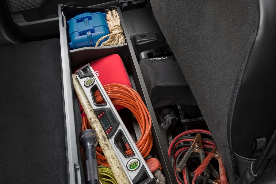 Items in storage bin underneath seat in a 2024 Ford Super Duty® truck
