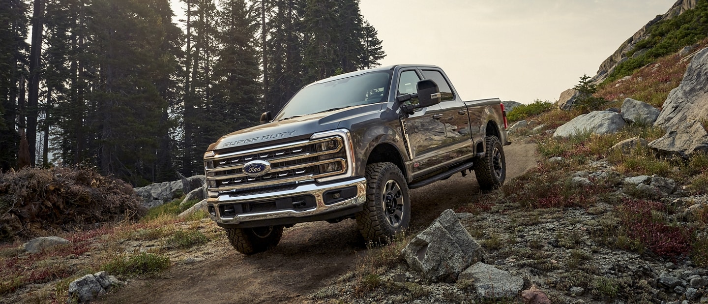2024 Ford Super Duty® F-250® Tremor® Off-Road Package being driven over a rocky path