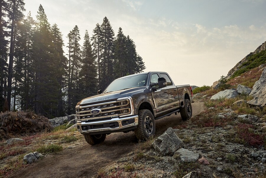 2024 Ford Super Duty® F-250® Tremor® Off-Road Package being driven over a rocky path