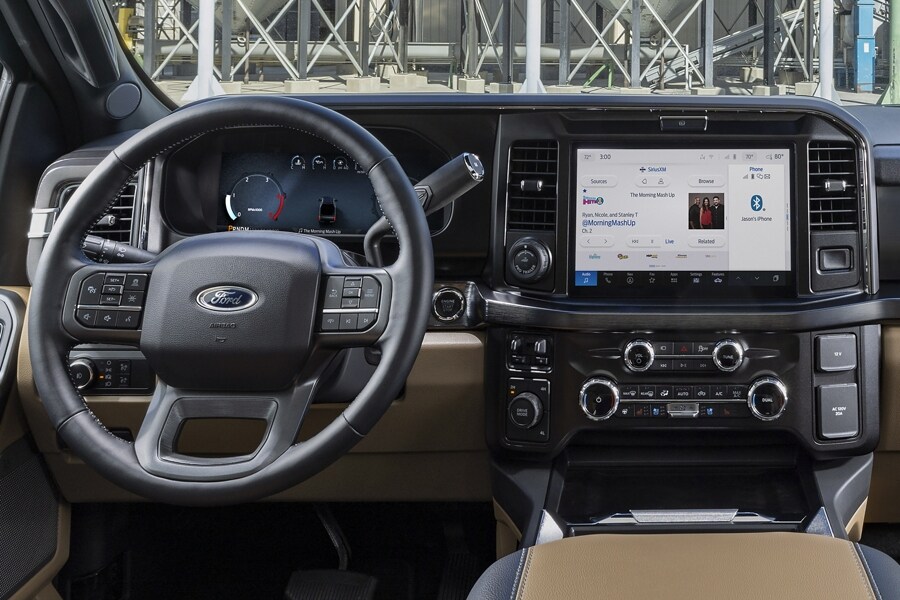 Interior of a 2025 Ford Super Duty® F-350® LARIAT® pickup parked near silos