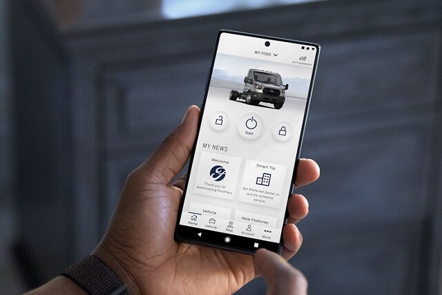 A person is looking at their phone that displays the FordPass® App