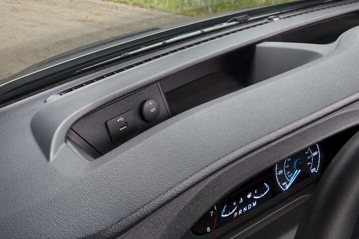 Close-up of a phone charging on the front dash USB port