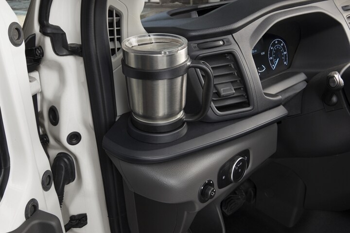 A coffee mug in the left side cupholder
