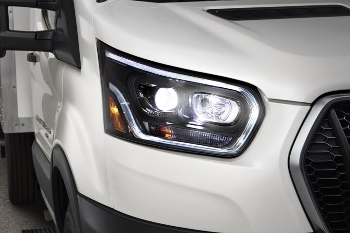 A close-up of the HID headlamps on a 2023 Ford Transit® Cutaway