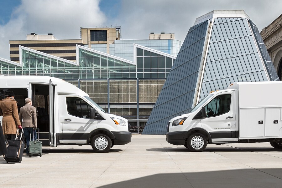 A 2023 Ford Transit® model with aftermarket shuttle bus body and a 2023 Ford Transit® with aftermarket utility body