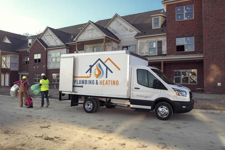 2023 Ford Transit® Chassis Cab box truck upfit on a new build site with workers
