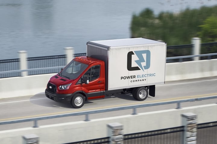 A 2023 Ford Transit® Chassis Cab being driven across a bridge