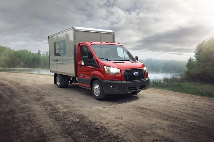 2023 Ford Transit® Cutaway box truck upfit driving on an unpaved road