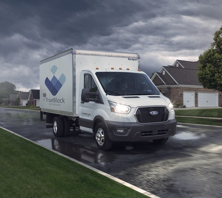 2023 Ford Transit® Chassis Cab being driven down a neighborhood road