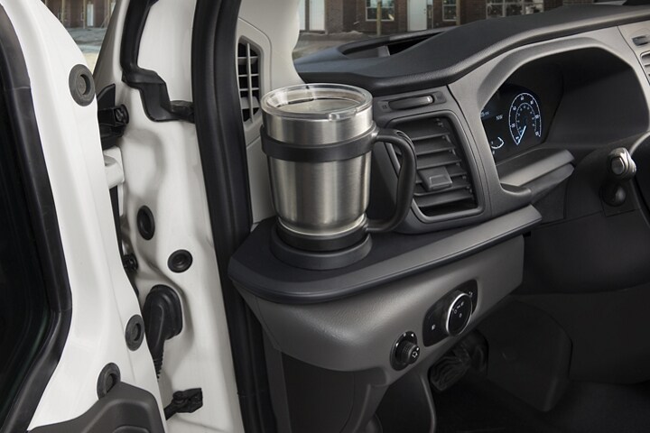 A coffee mug in the left side cupholder