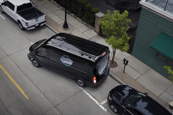 A 2023 Ford Transit® van being parallel parked