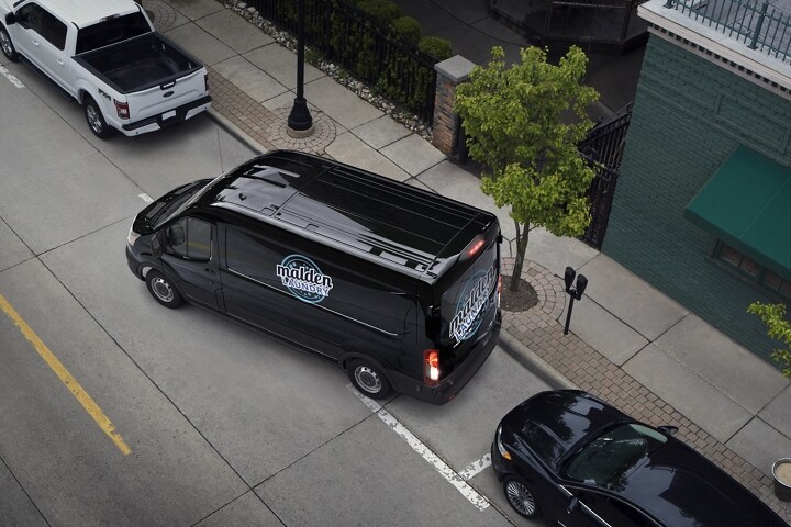 A 2023 Ford Transit® van being parallel parked