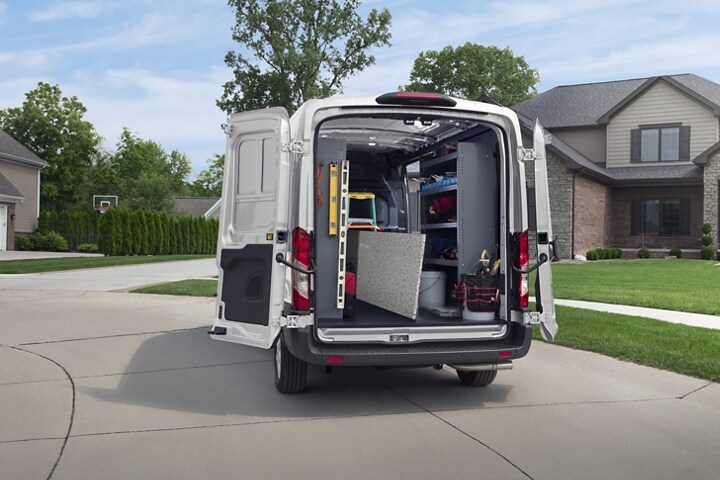 A 2023 Ford Transit® van seen from behind with open cargo doors