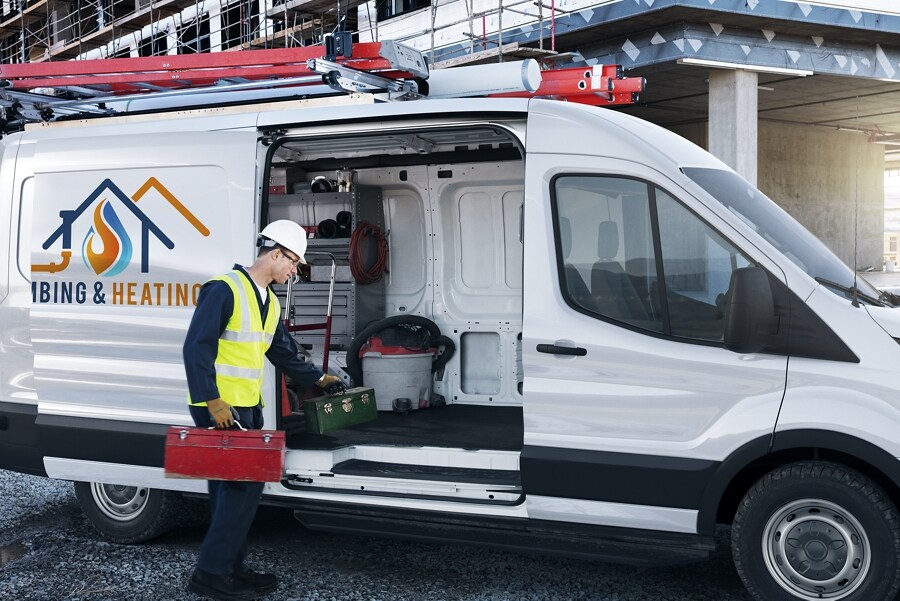 A man loading equipment into a 2023 Ford Transit® Van