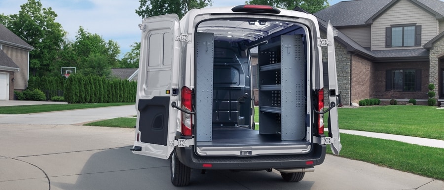 Shot of the cargo area of a 2023 Ford Transit® van with shelving