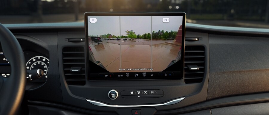 A side-by-side shot of the camera on the grille of a 2023 Ford Transit® van and the camera on rear